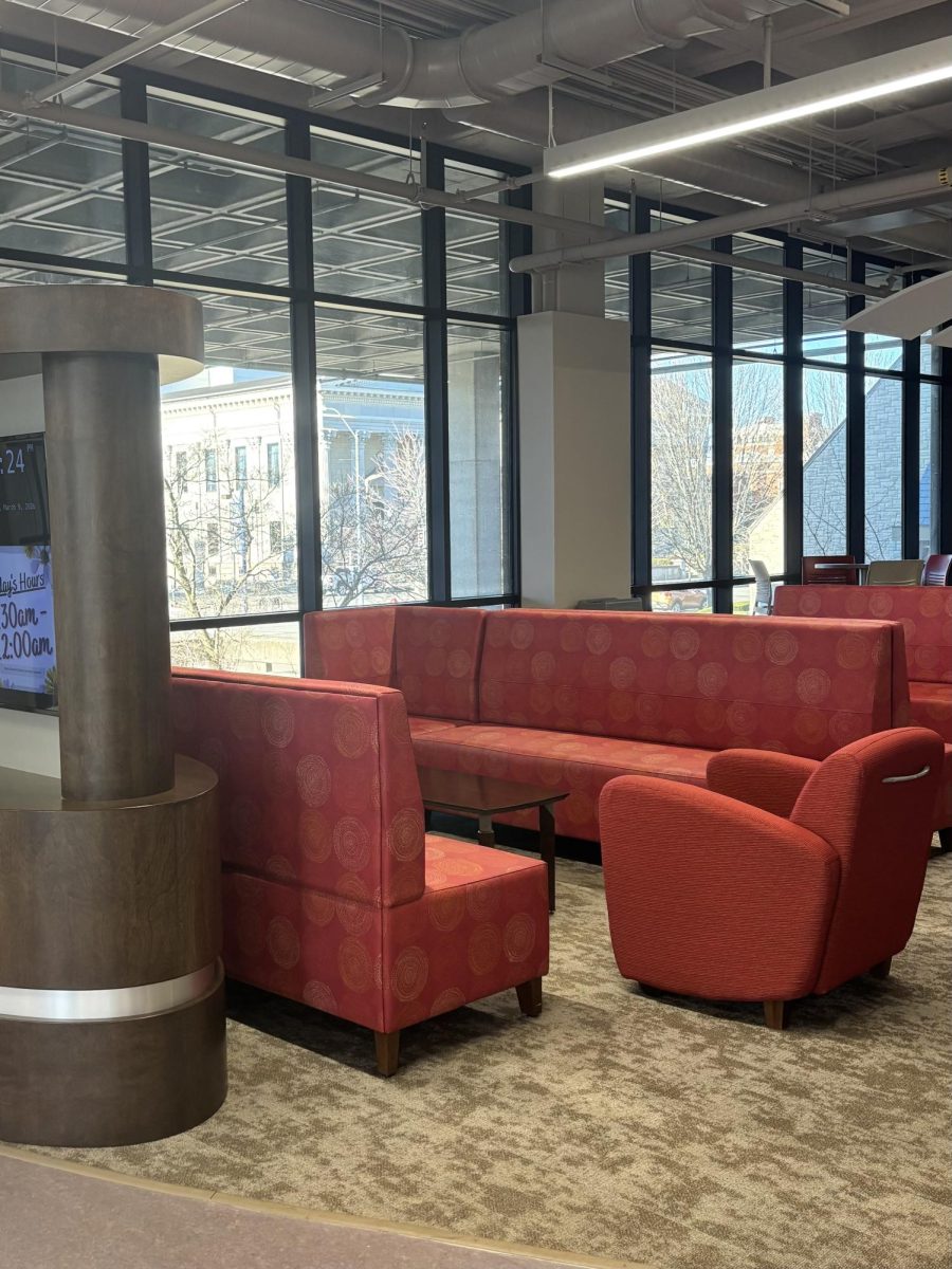 Nash Library first-floor lounge with plush seating near the cafe — photo by Bailey Clements